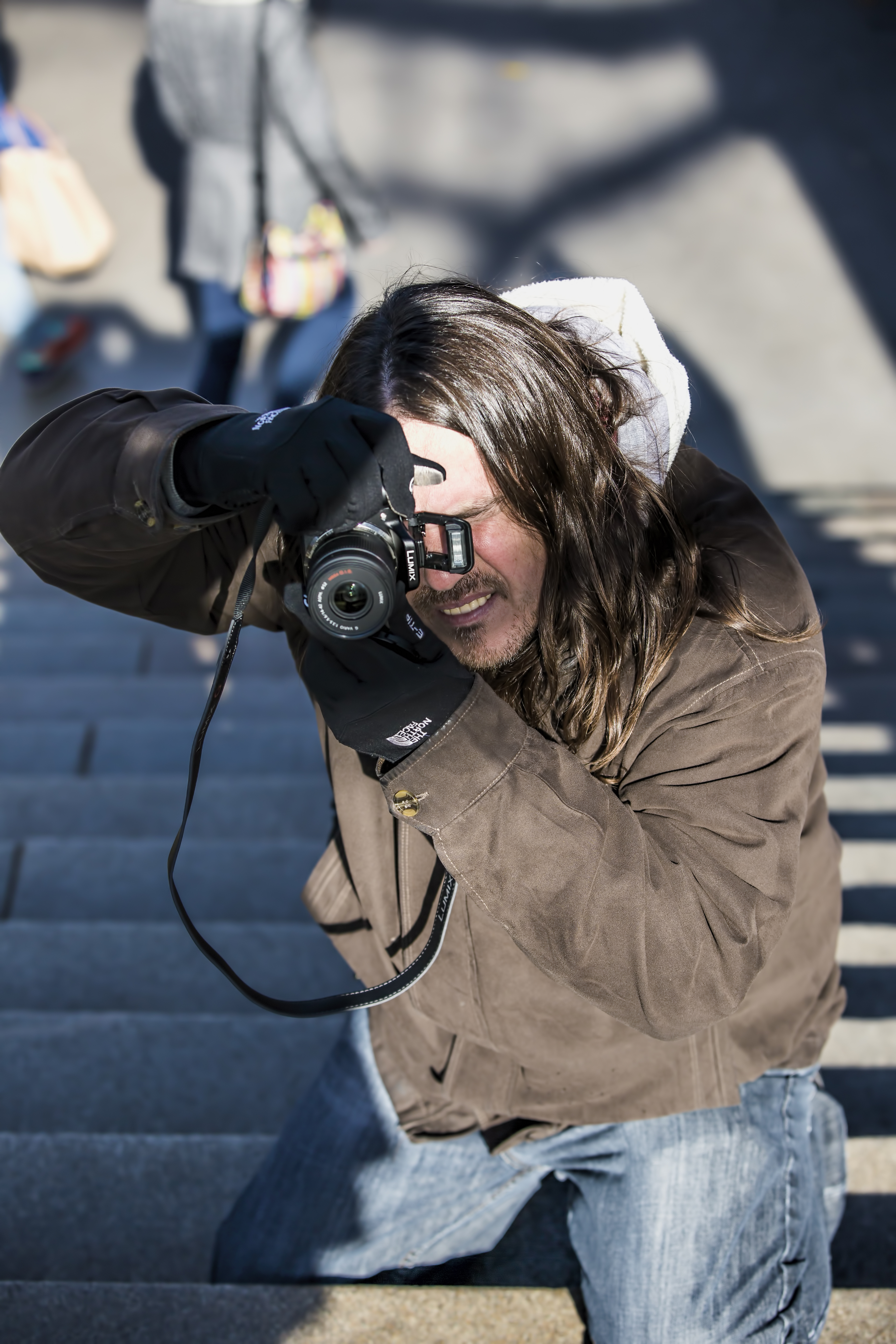 Vernon Webb photographing with a camera